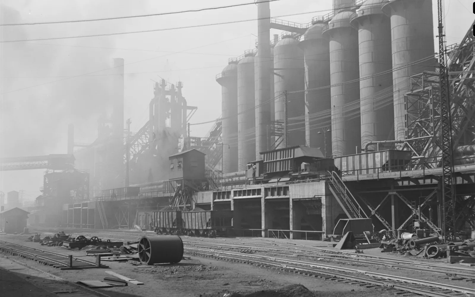 Industrial steel mill facility with smokestacks and manufacturing buildings